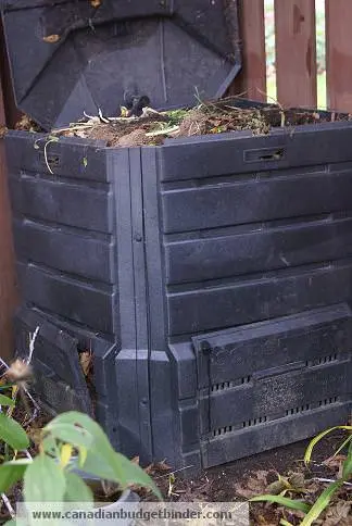 Compost bin with organic waste in the top Compost bin with organic waste in the top