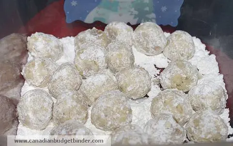 First Roll Holiday Snowballs in Icing Sugar while still hot