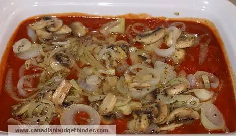 Layer onions and mushrooms in pasta sauce
