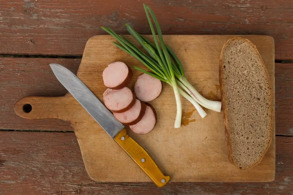 lunch box ideas
Wood Cutting Board With Bread, Spring Onions and Kielbasa Slices
