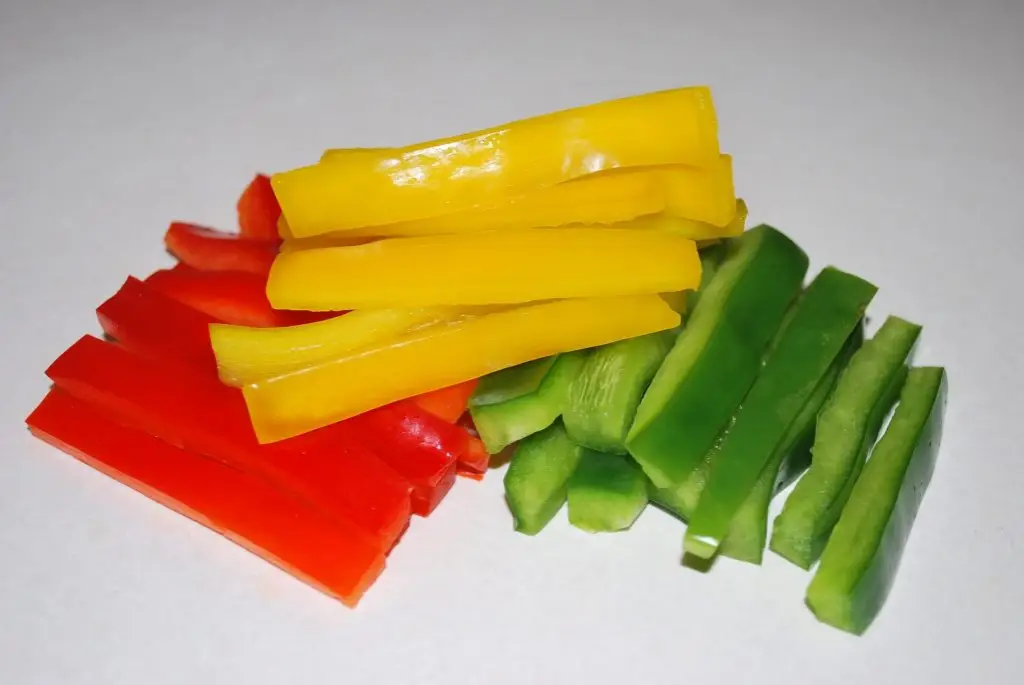 Sliced raw red, yellow and green peppers for back to school lunch ideas.