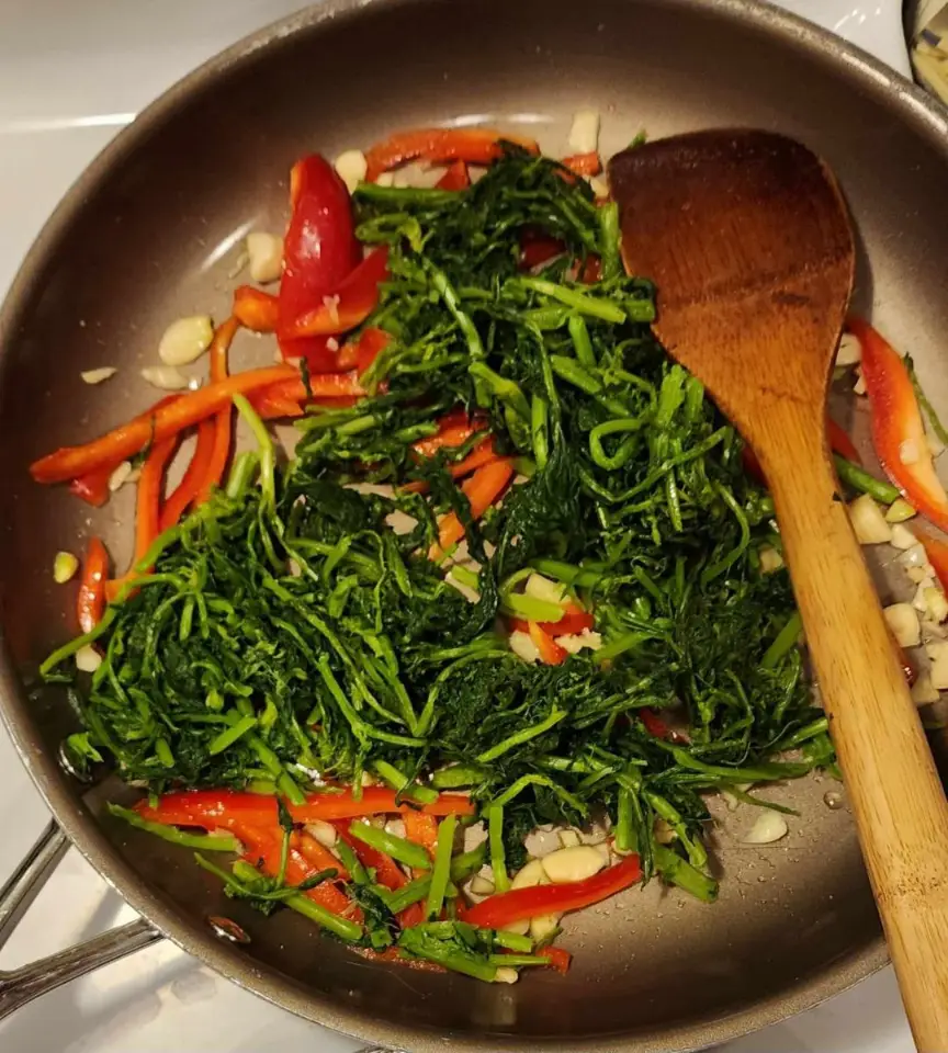 Frying Italian Rapini and Sweet Red Bell Peppers