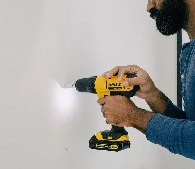 flipping-houses-for-profit-man-drilling