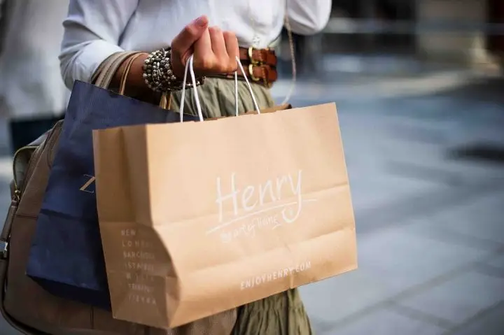 Impulse buying lady with lots of shopping bags.