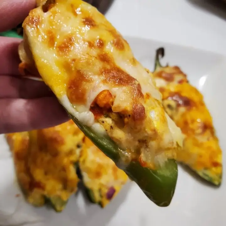 Homemade Jalapeno Poppers stuffed with cream cheese filling, bacon and more cheese. Keto friendly.