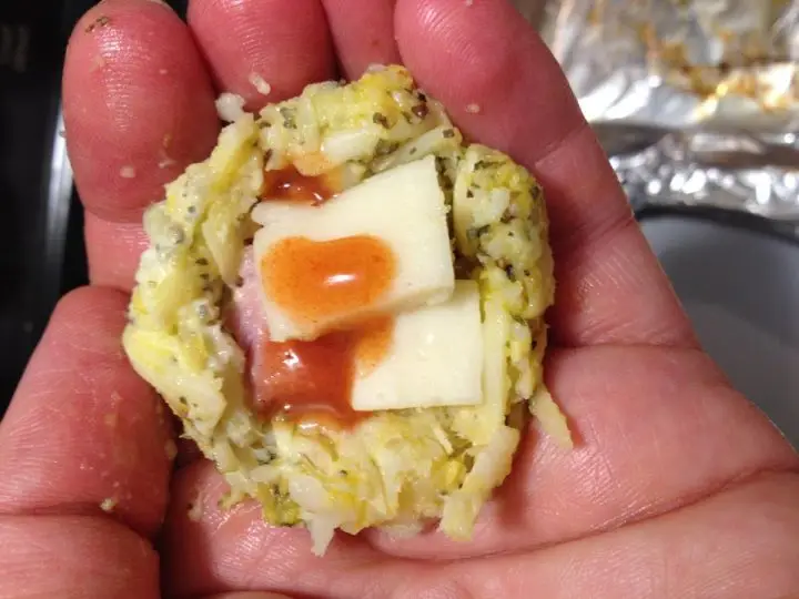 Make an indent into the cauliflower rice pizza ball to add your cheese chunks