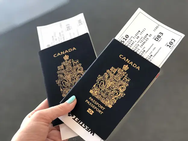 Two Canadian Passports with Sports Tickets Inside