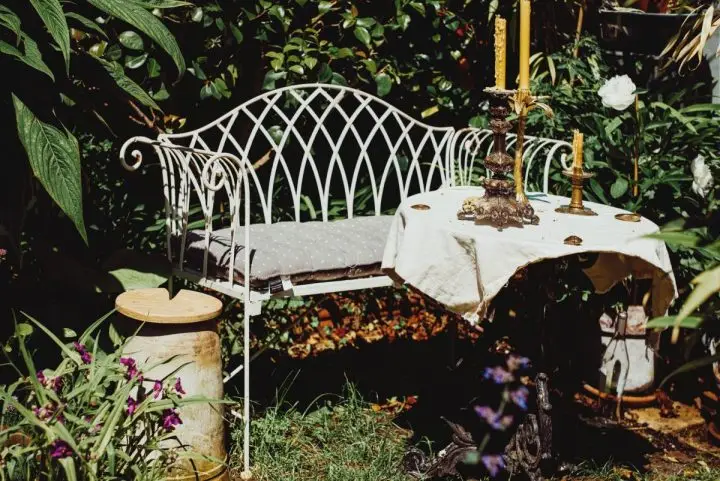 Afternoon Tea in a British Garden with cakes, cookies, tea and cucumber sandwiches