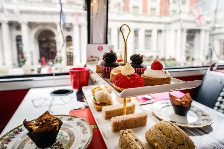 British Restaurant table with tea, cakes and sandwiches.