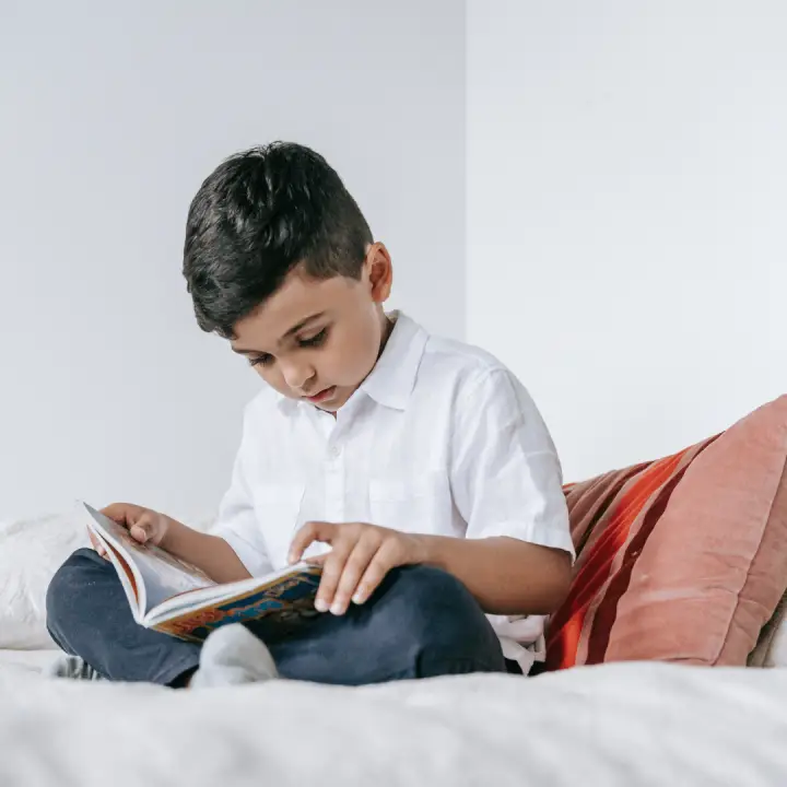 Little-Boy-Reading-a-Book-720x720