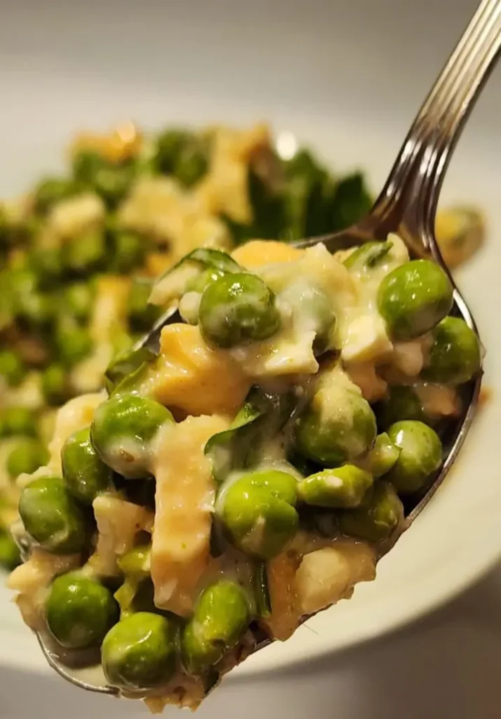 A Spoonful of Creamy Baked Atlantic Salmon Green Peas Salad.