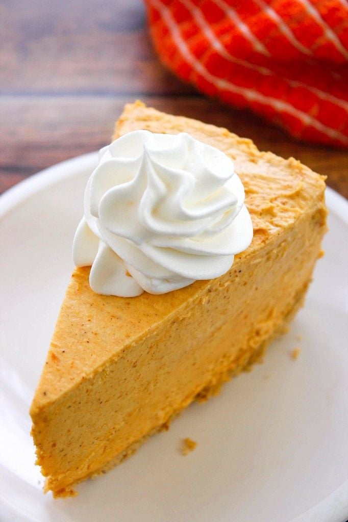 Slice of pumpkin cheesecake on a plate